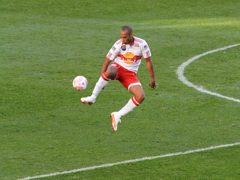 soccer player kicking ball