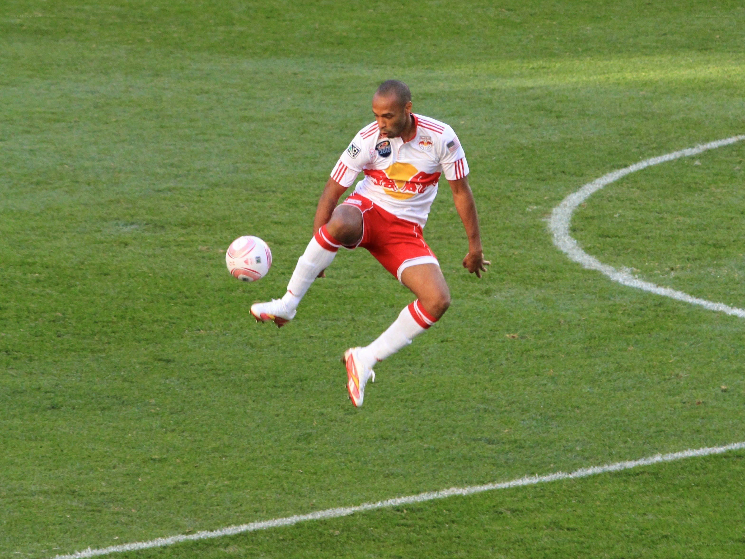 soccer player kicking ball