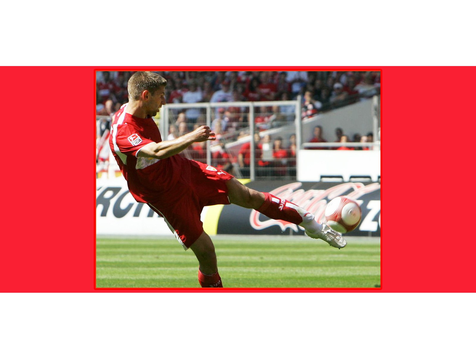 soccer player kicking ball