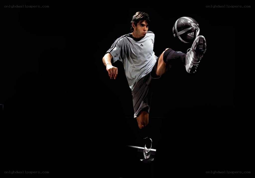 soccer player kicking ball