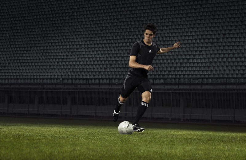 Soccer Player Kicking Ball — Black, Dramatic, Night, Photograph, Stadium