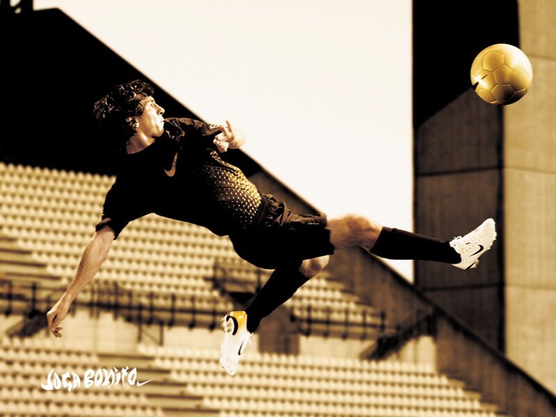 Soccer Player Kicking Ball — Black, Dramatic, Photograph