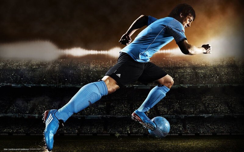 Soccer Player Kicking Ball — Blue, Dramatic, Night, Photograph, Stadium, Crowd