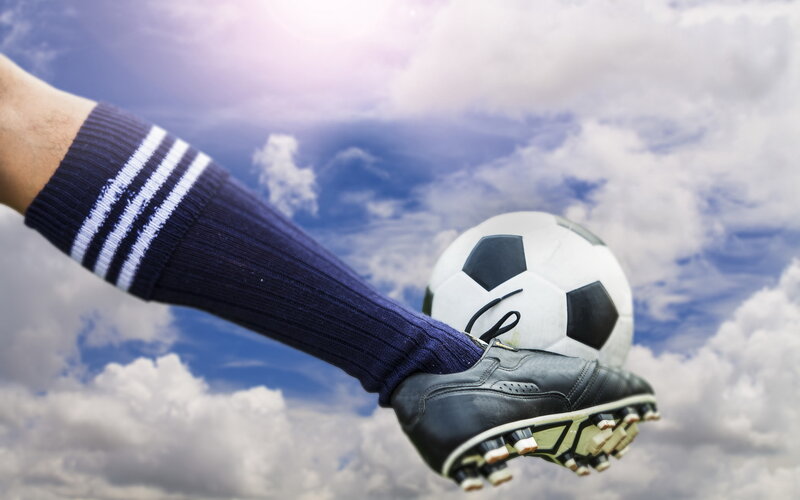 Soccer Player Kicking Ball — Blue, Dynamic, Afternoon, Photograph