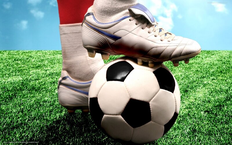soccer player on grass field