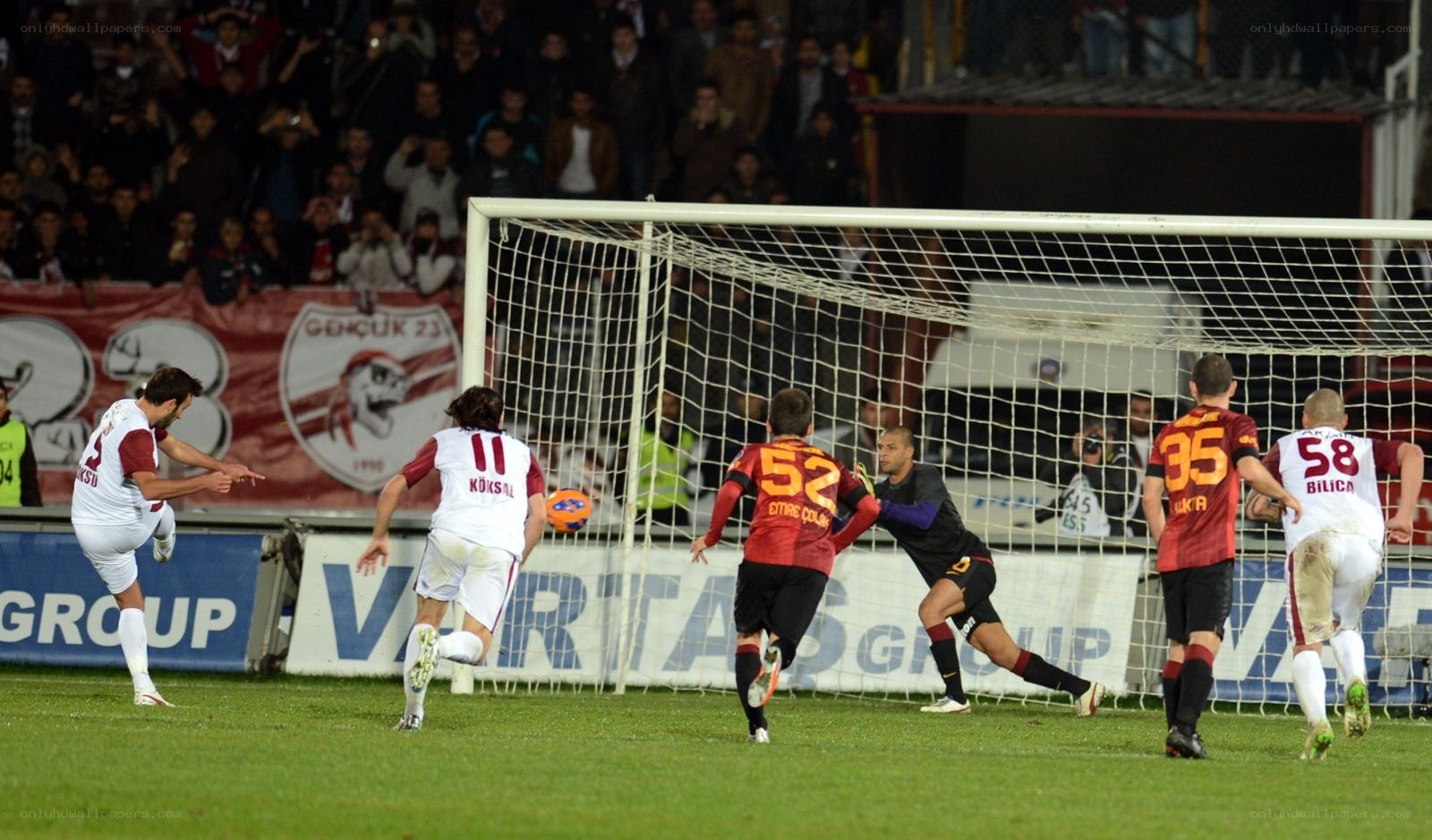 Soccer player scoring a goal