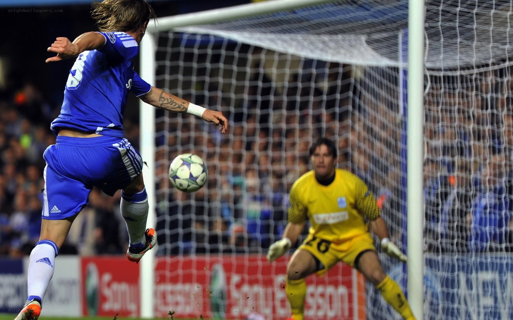 Soccer player scoring a goal
