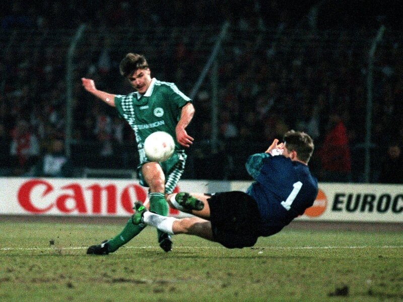 Soccer Player Tackling Goalkeeper