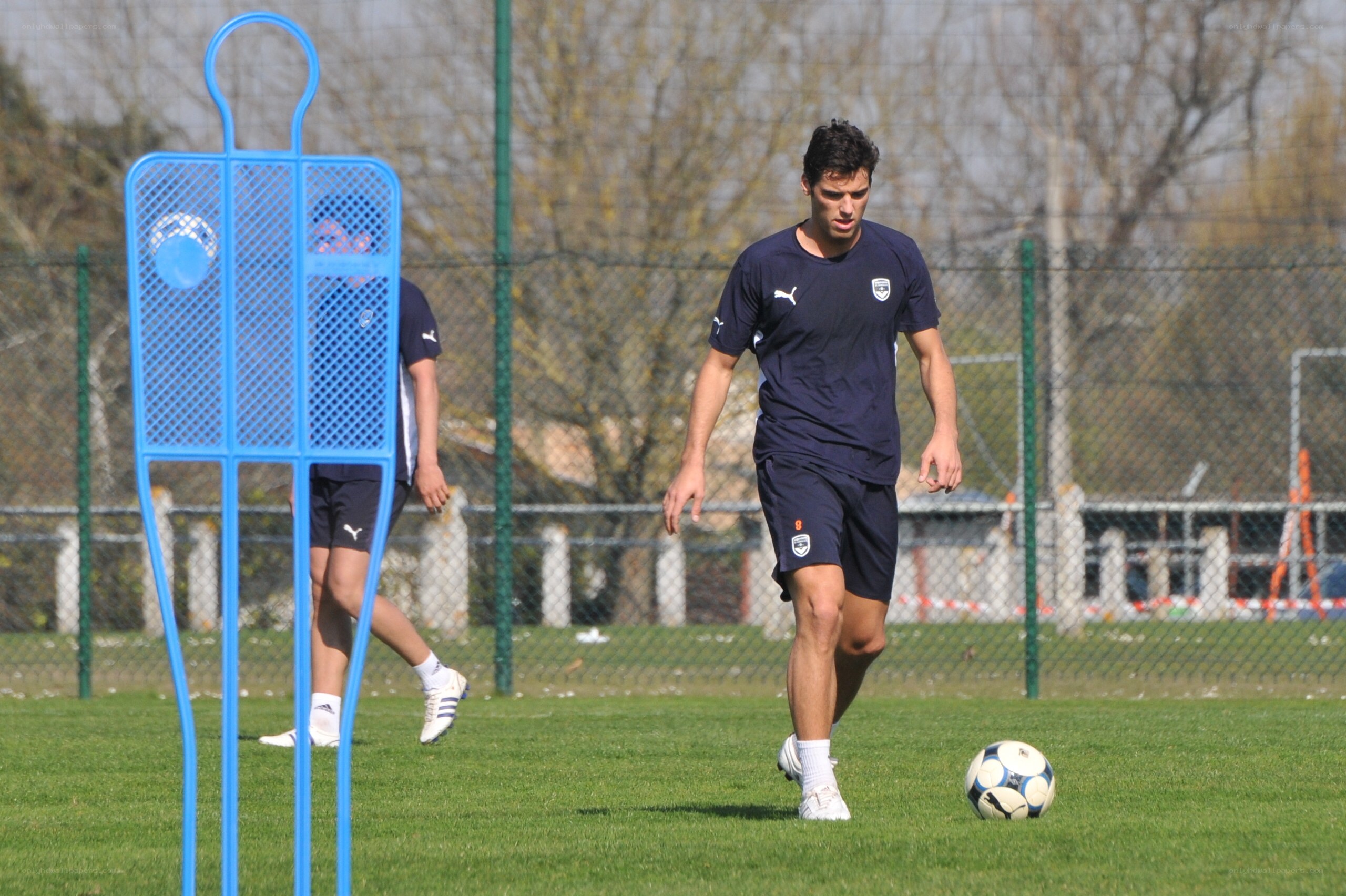 Soccer player training on field