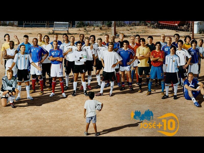 Soccer players and a child