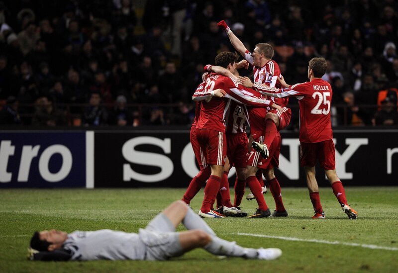 Soccer players celebrate a goal