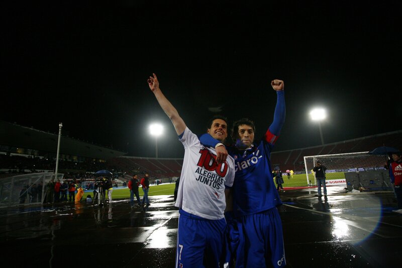Soccer players celebrate on field