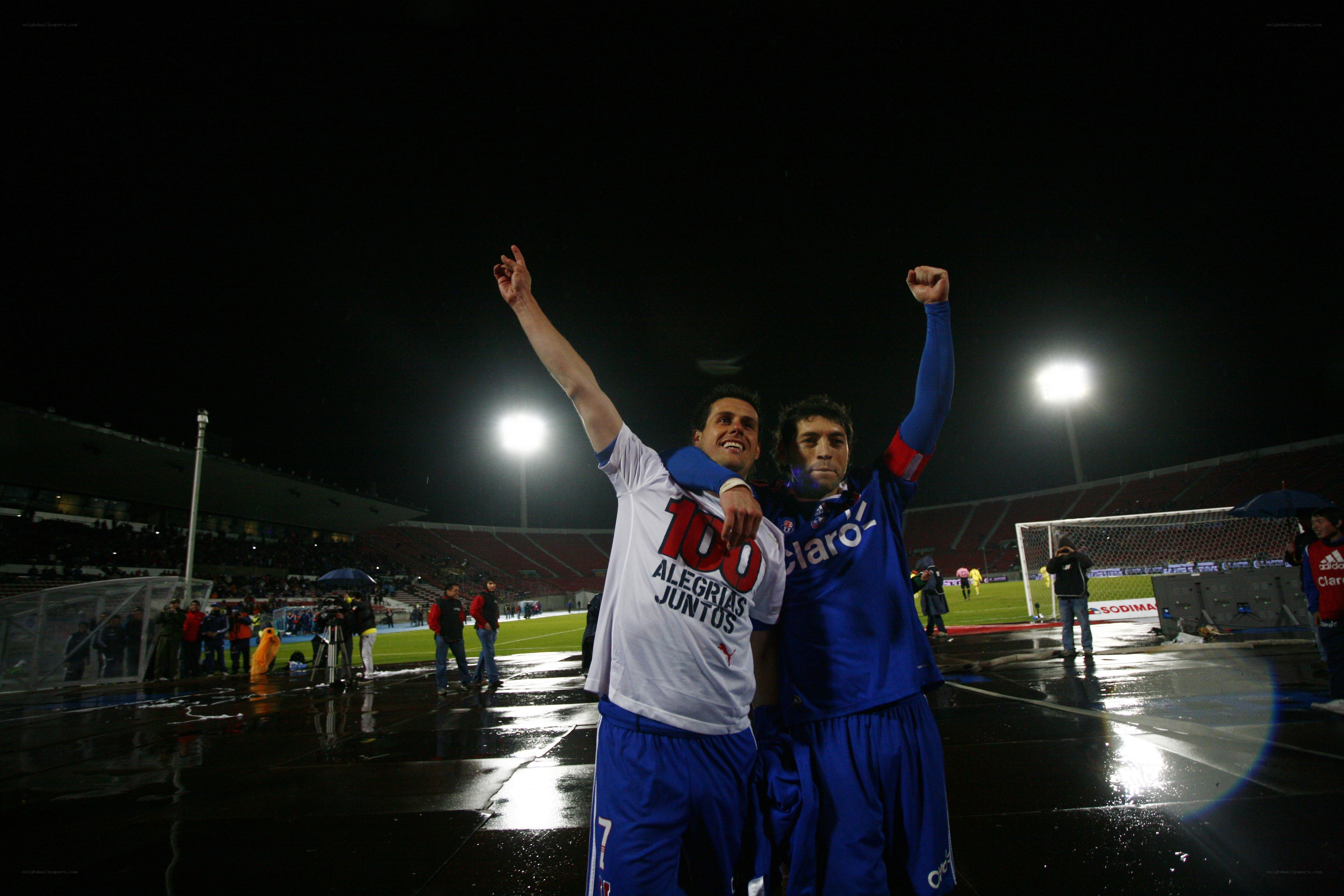 Soccer players celebrate on field
