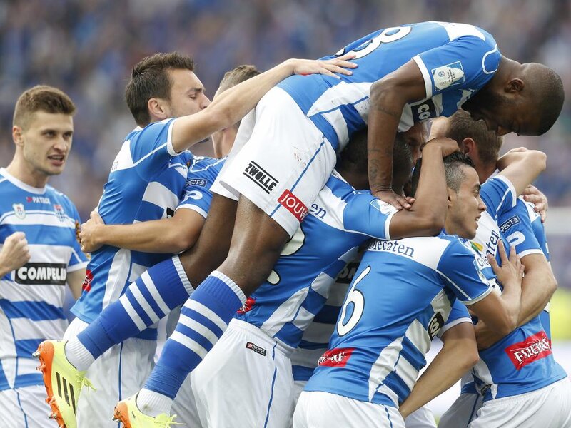 Soccer Players Celebrating — Blue, Celebratory, Afternoon