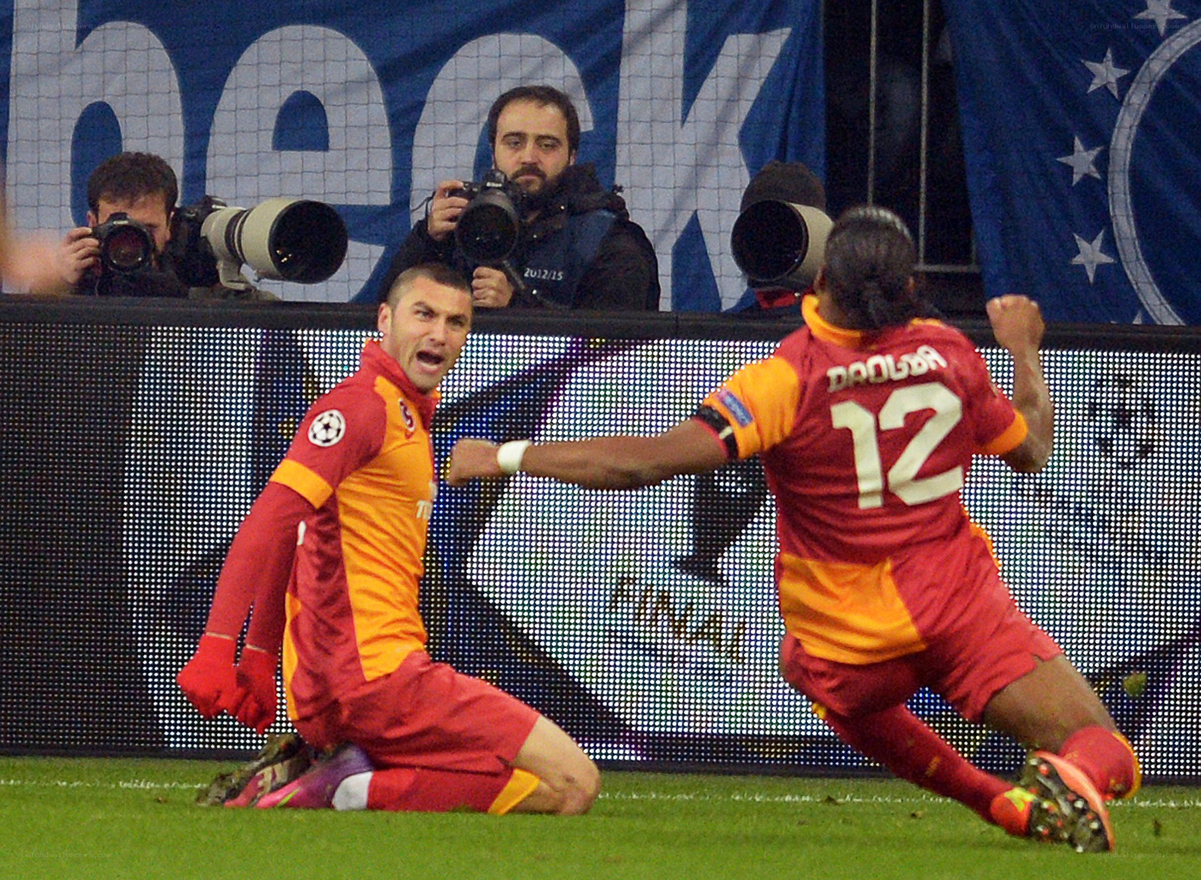 Soccer players celebrating goal