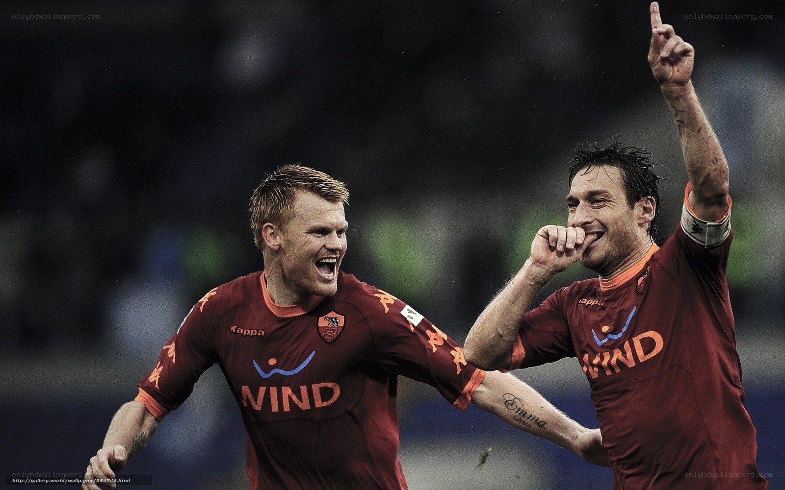 Soccer players celebrating goal