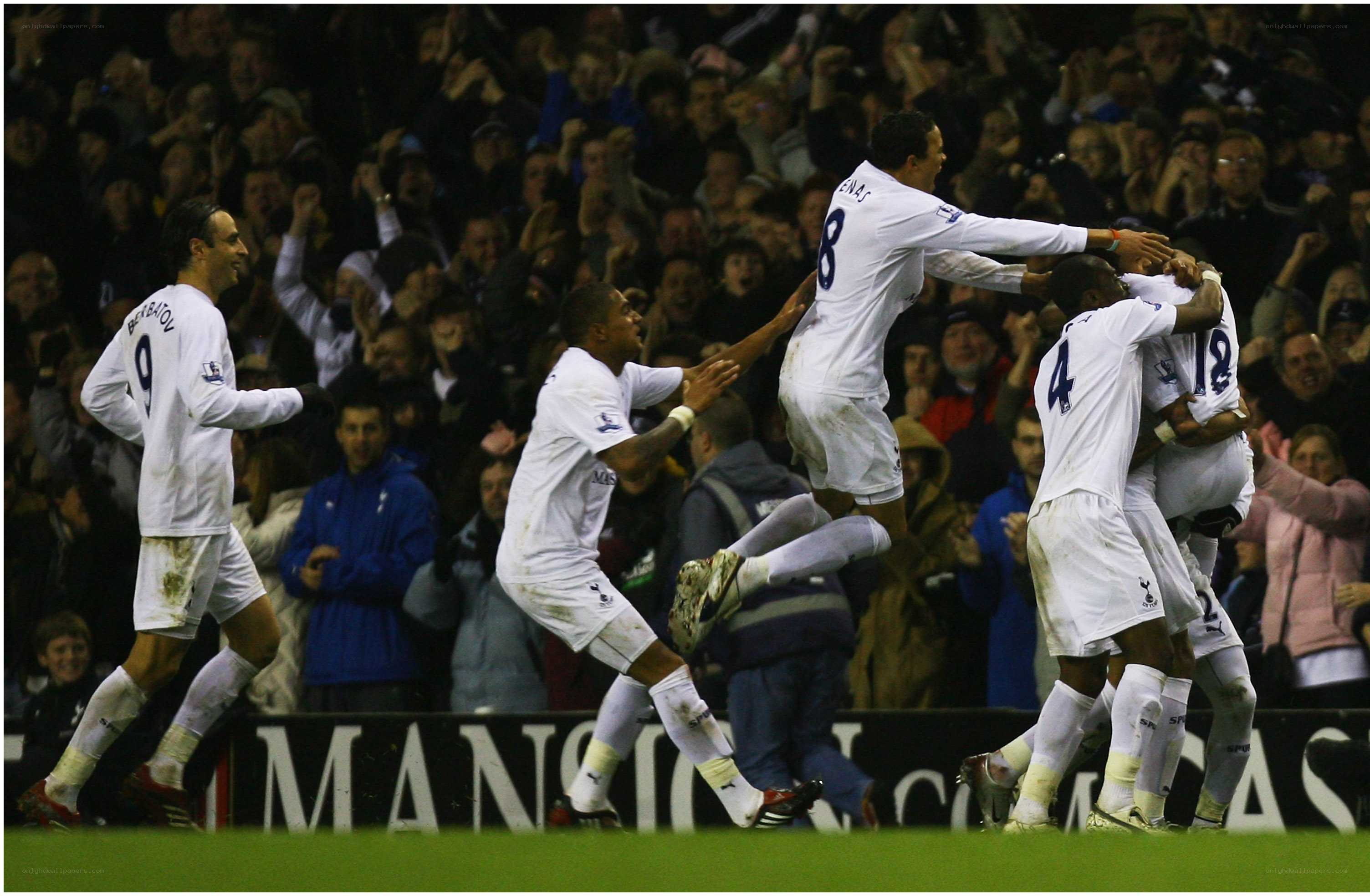 soccer players celebrating goal