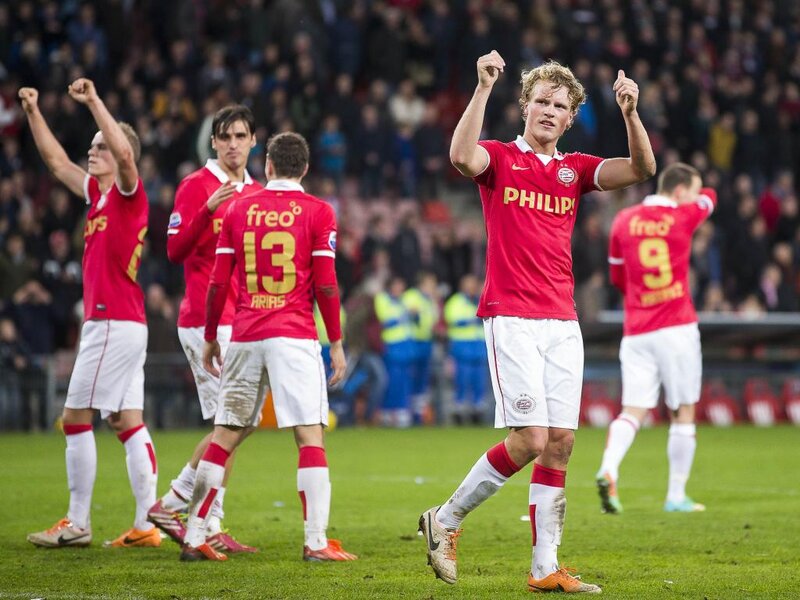 Soccer Players Celebrating — Red, Celebratory, Night, Photograph, Crowd