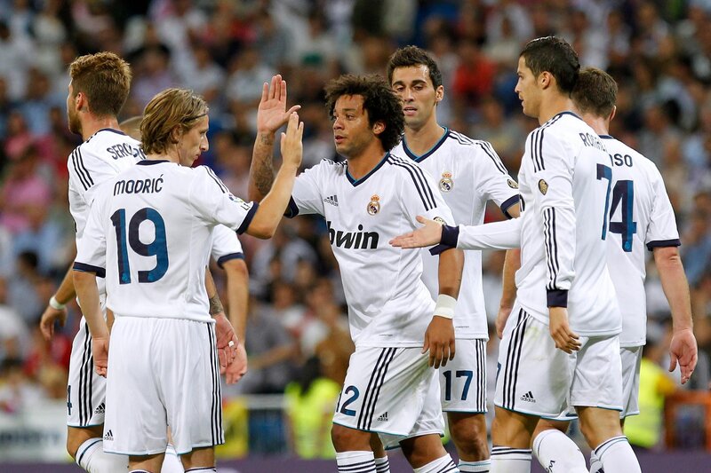 Soccer Players Celebrating — White, Celebratory, Night, Photograph, Jerseys, Stadium, Crowd