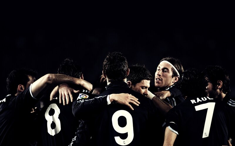 Soccer Players Hugging — Black, Dramatic
