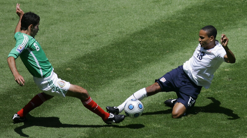 Soccer players in action on field
