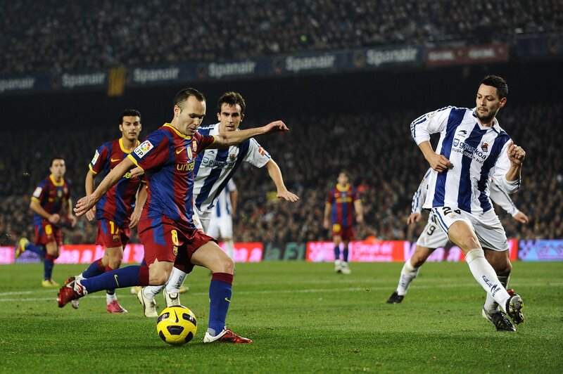 Soccer players in action on field