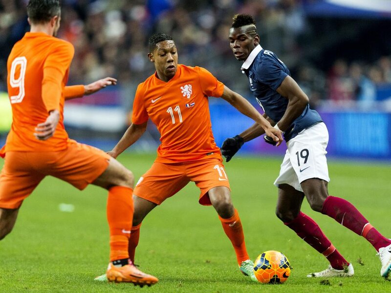 Soccer Players in Action — Orange