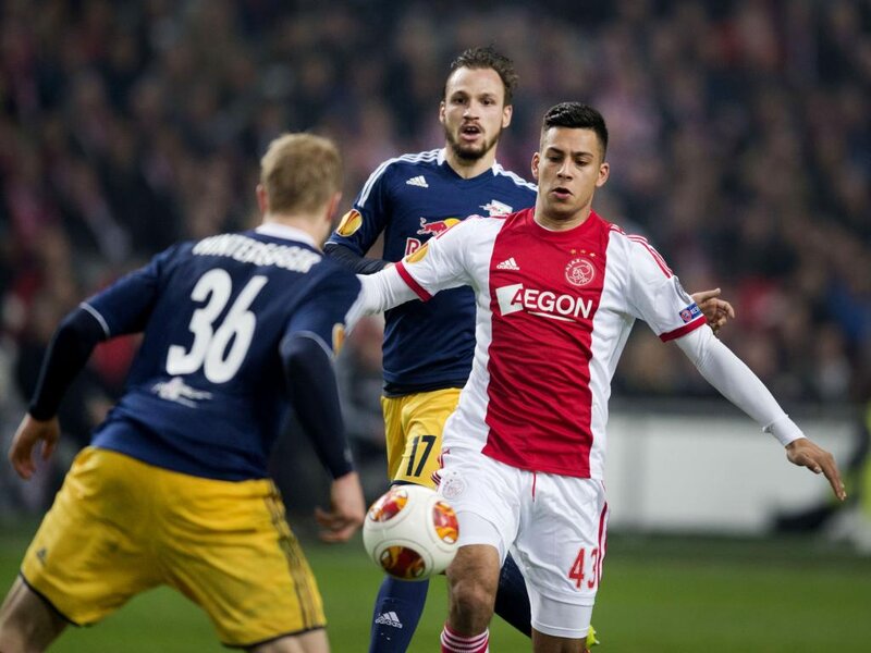 Soccer Players in Action — Red