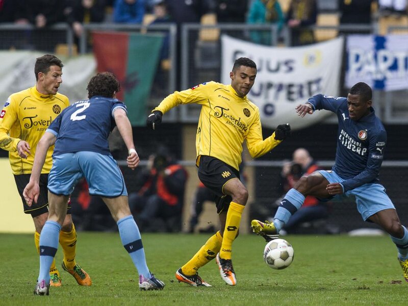 Soccer Players on Field — Yellow