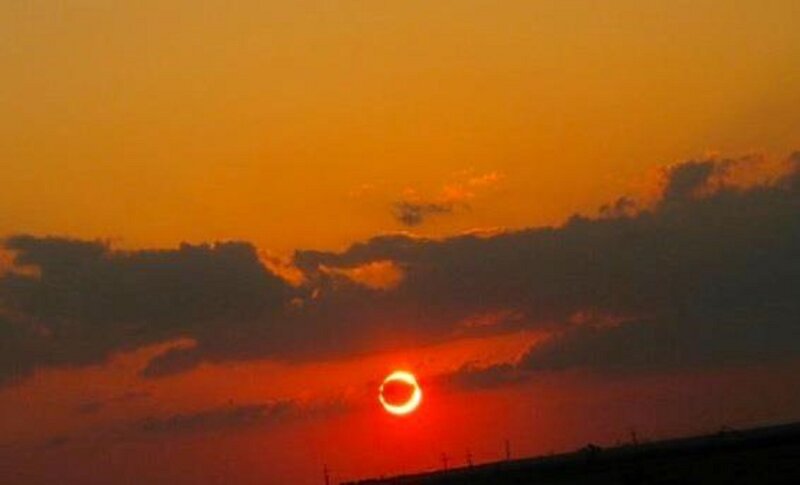 Solar Eclipse at Sunset — Orange, Dramatic