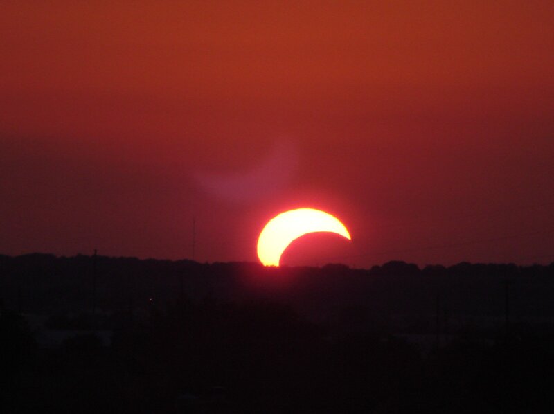 Solar Eclipse at Sunset — Red, Dramatic
