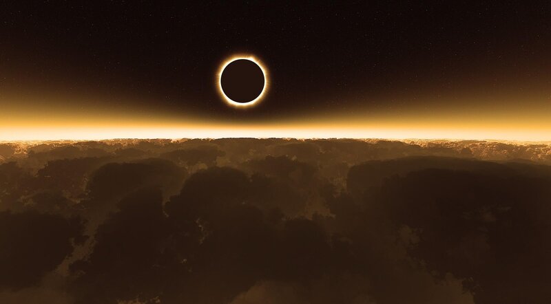 Solar eclipse over clouds