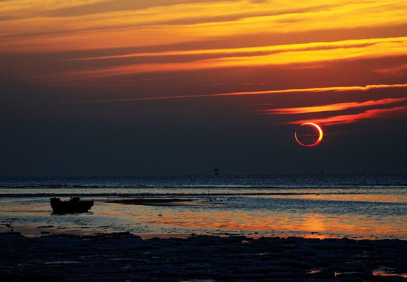 Solar Eclipse over Sea — Orange