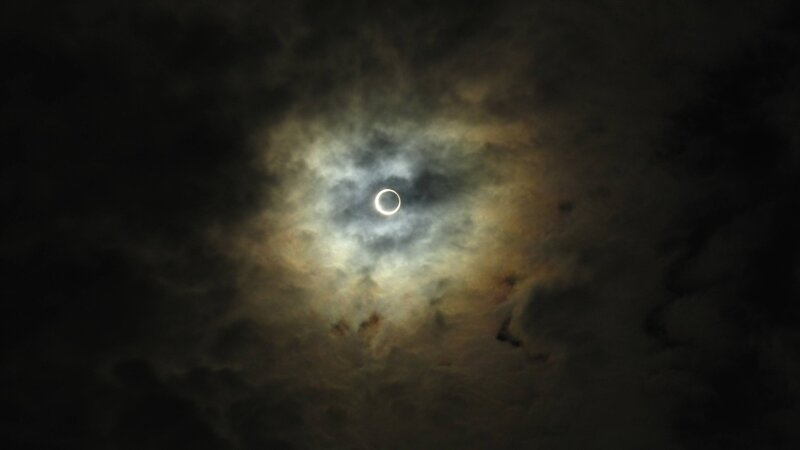 Solar eclipse through clouds