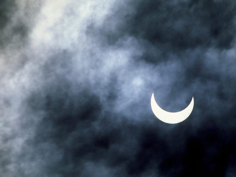 Solar eclipse through clouds