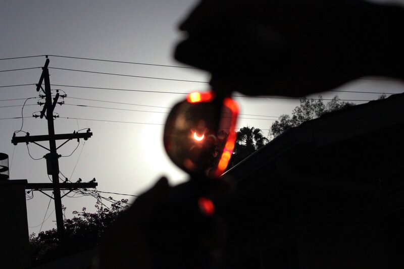 Solar Eclipse Through Glasses — Black