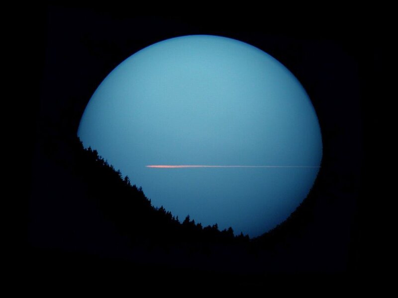 Solar Eclipse with Contrail