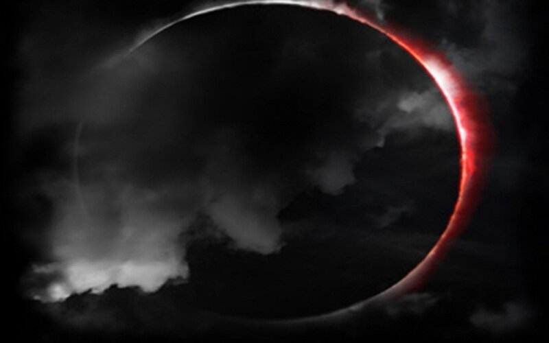 solar eclipse with red corona