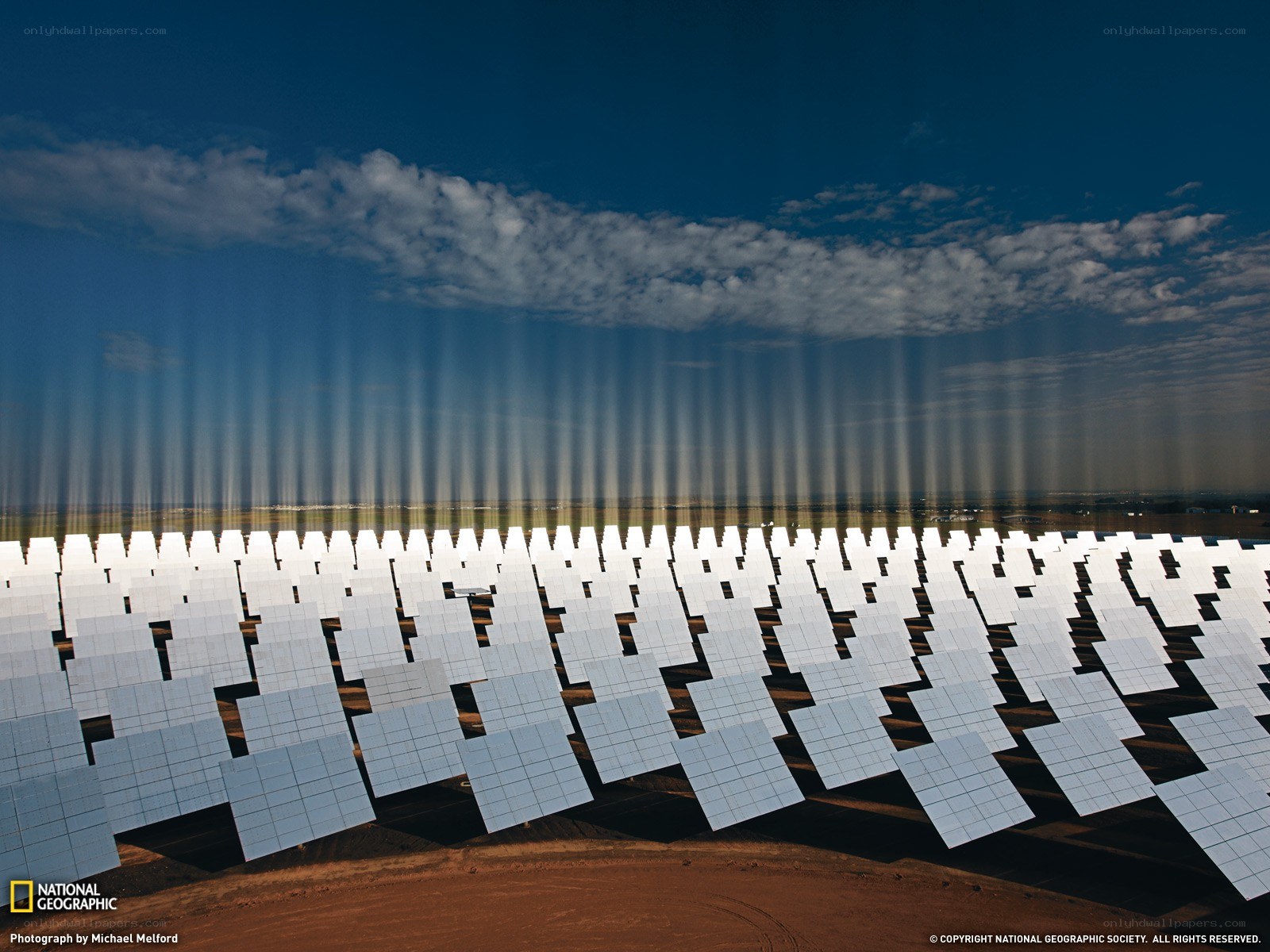 Solar farm with sunbeams