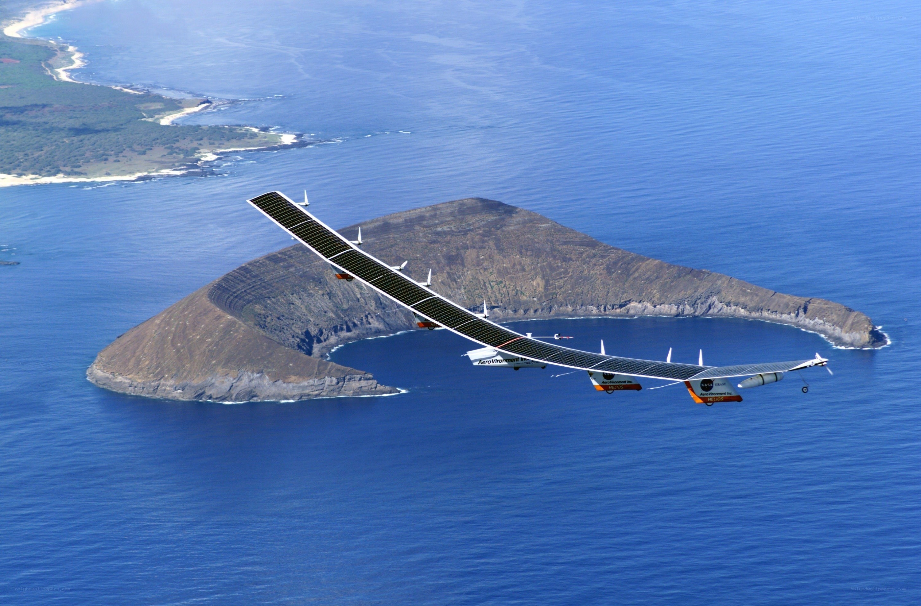 Solar-powered airplane flying over island
