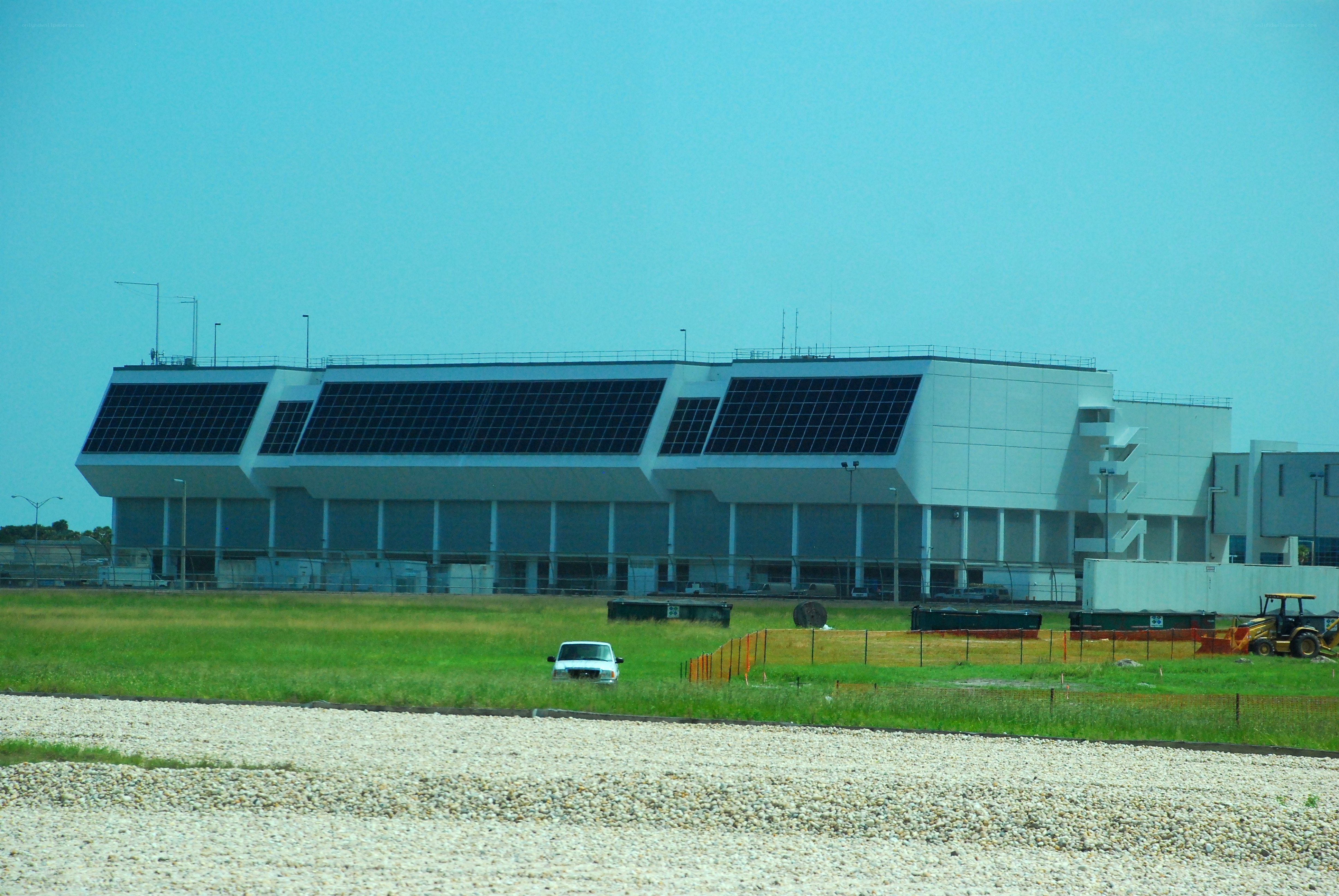solar-powered building with green field