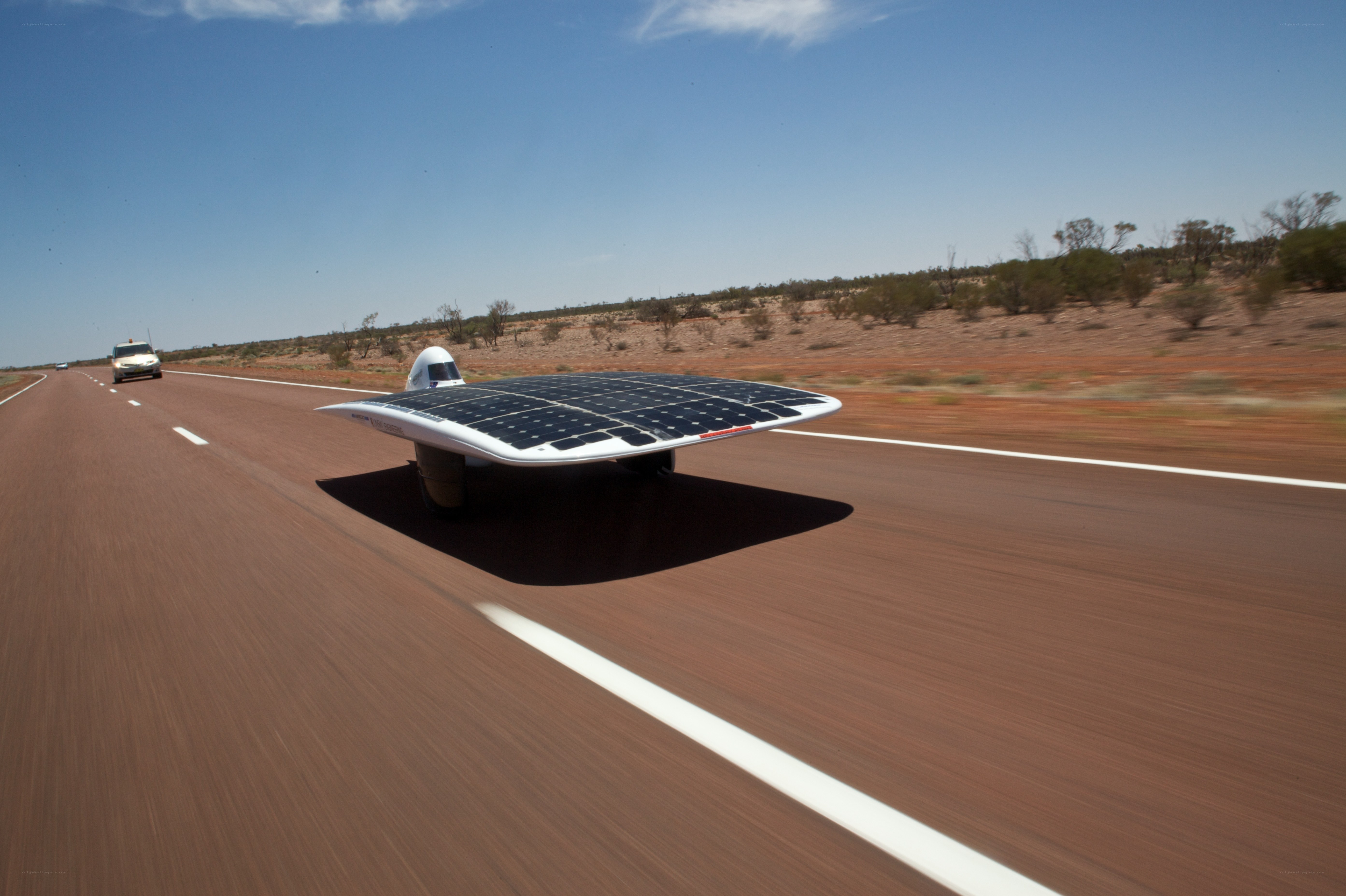 Solar-powered car on desert road
