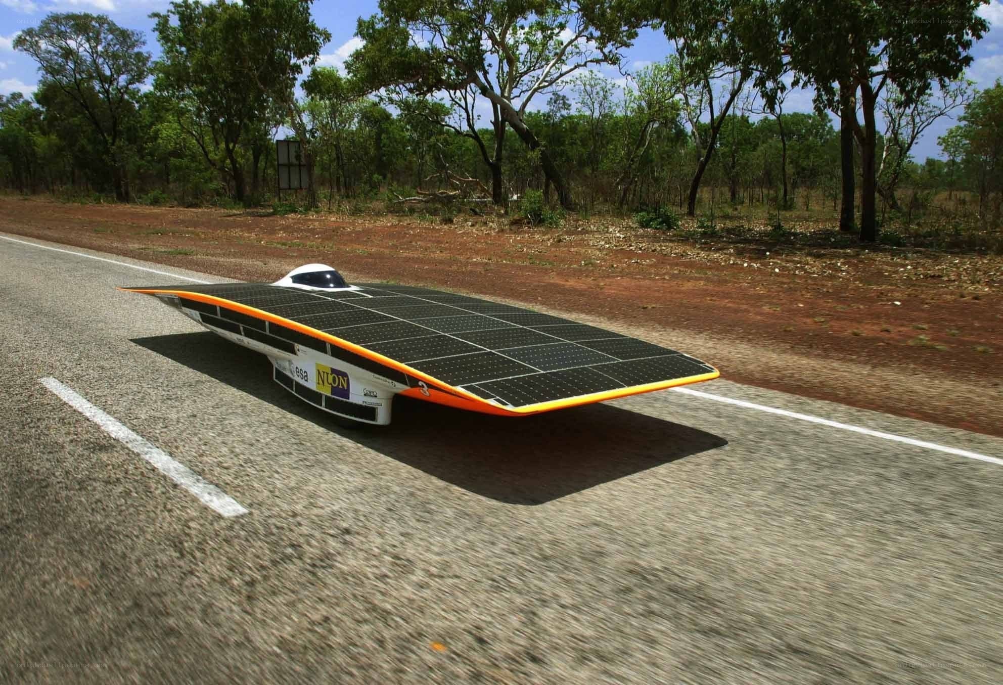 Solar-powered race car on road
