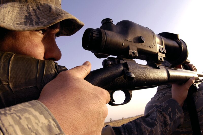 Soldier Aiming Rifle — Brown, Focused