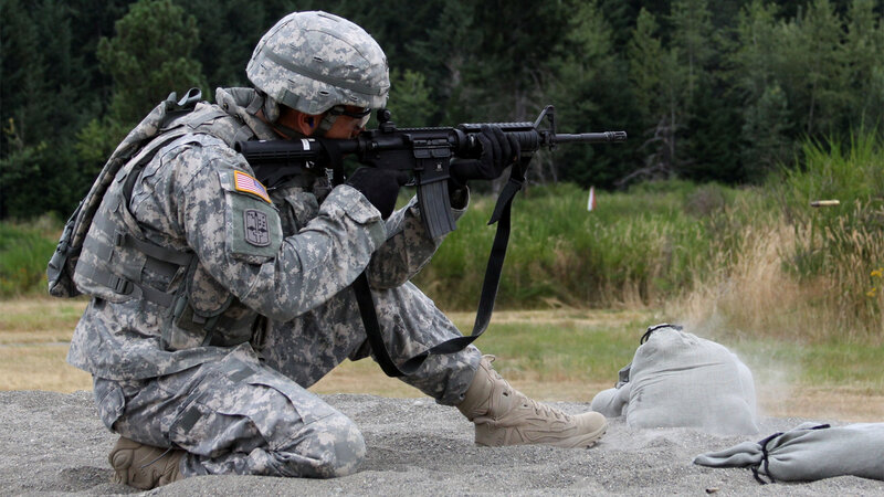 Soldier Aiming Rifle — Green, Focused, Afternoon