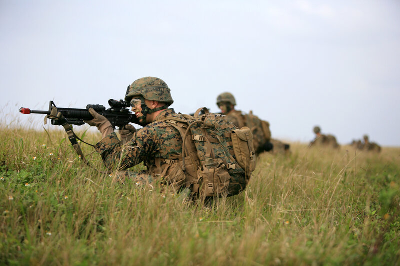 Soldier Aiming Rifle — Green, Tense, Afternoon, Photograph, Backpack, Helmet