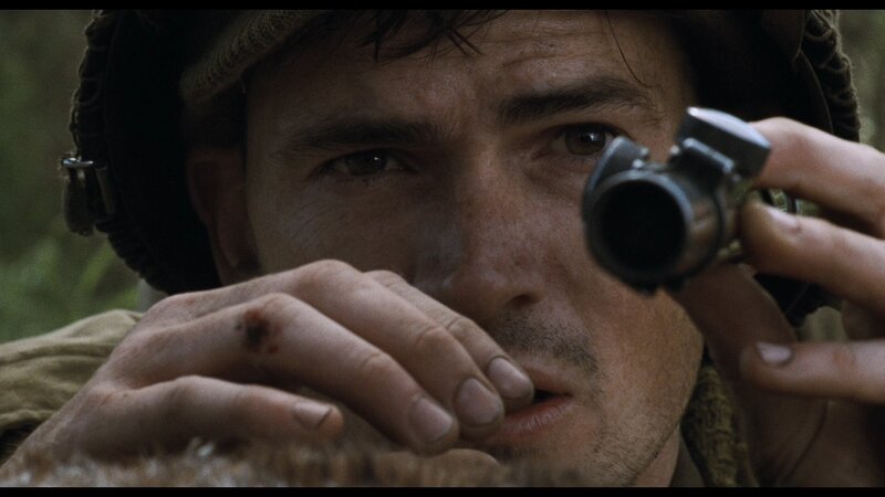 soldier aiming rifle in forest