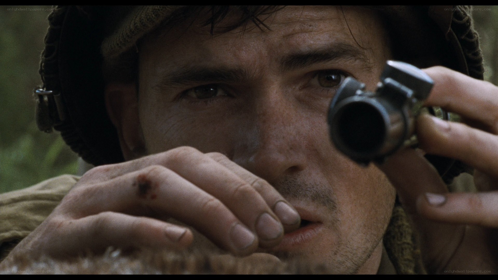 soldier aiming rifle in forest