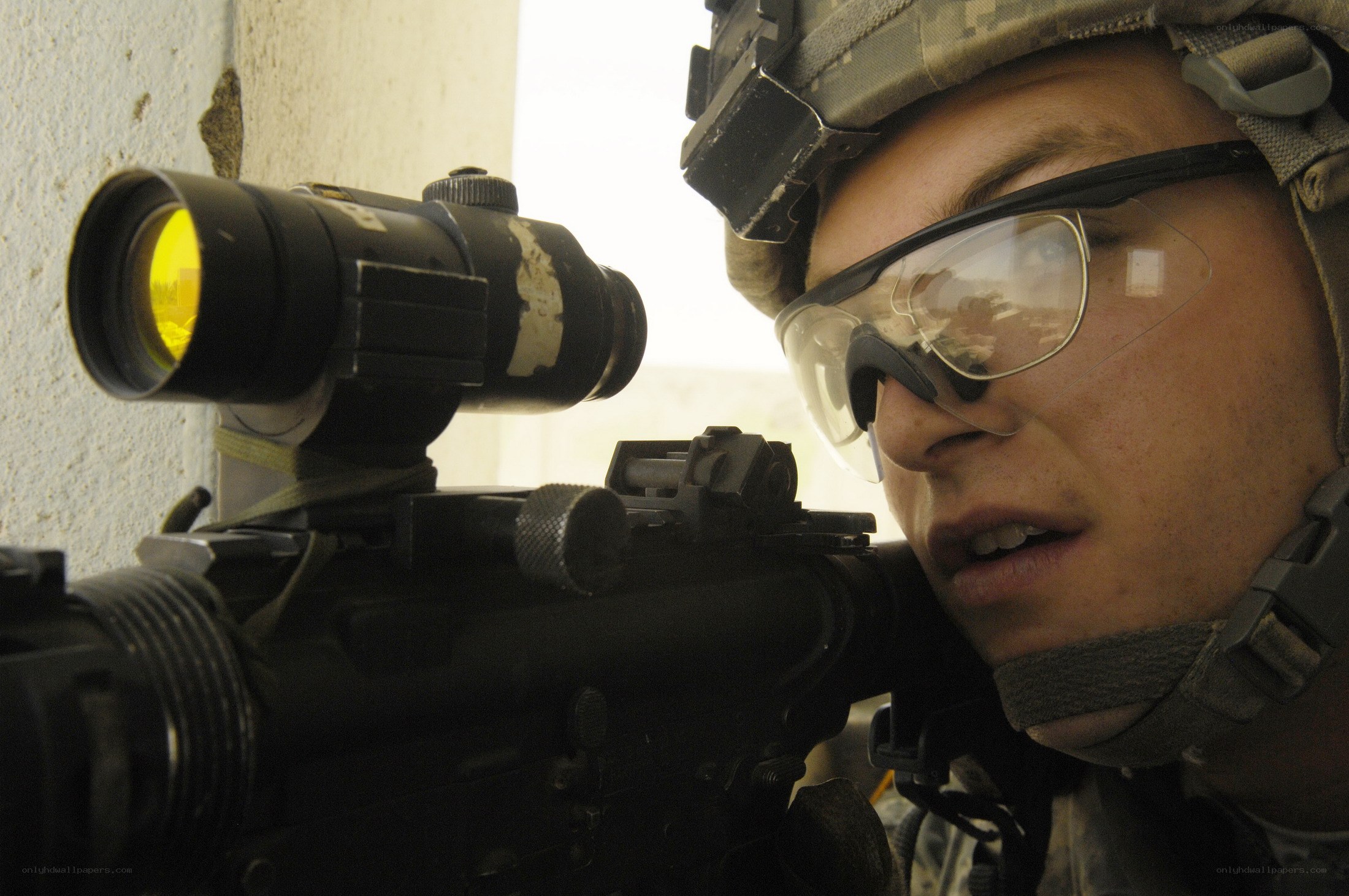 soldier aiming rifle with scope