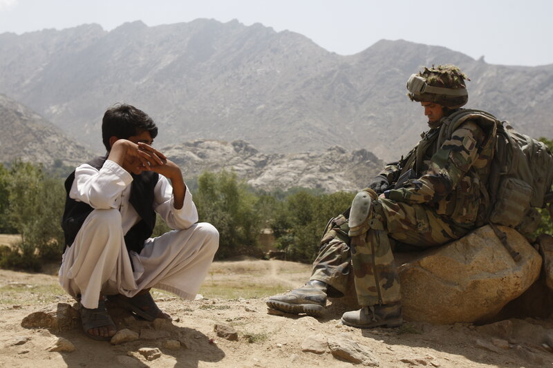 Soldier and boy in mountainous region